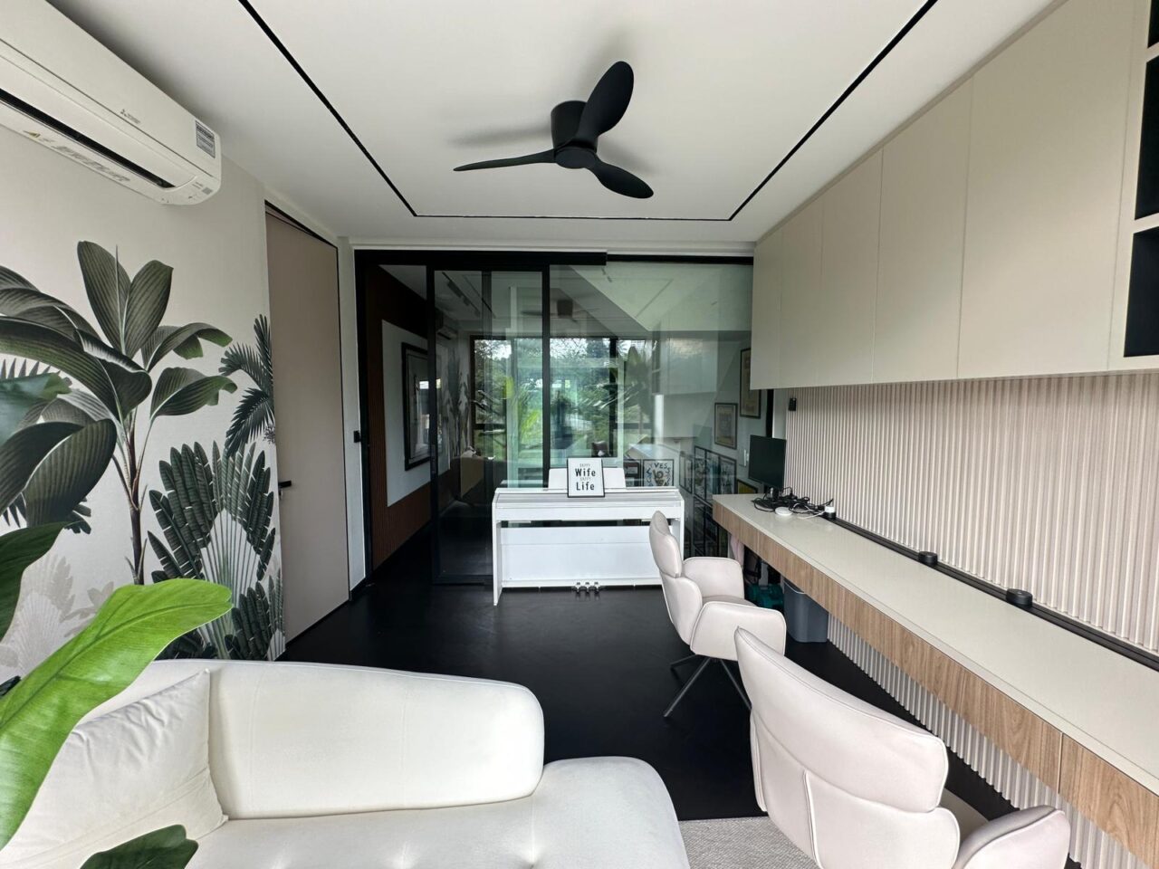 Modern home office with tropical theme decor.