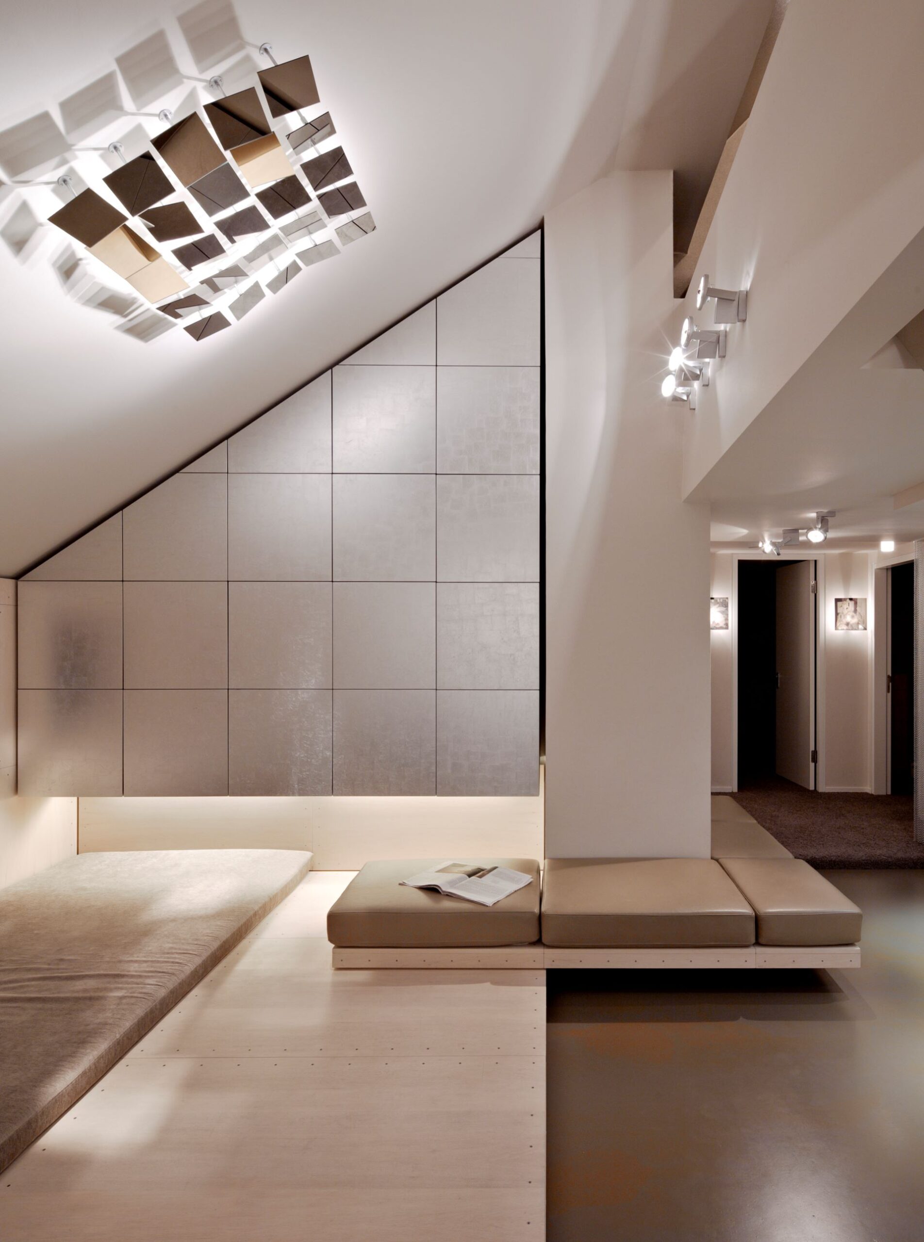 Modern minimalist interior with geometric wall decor.